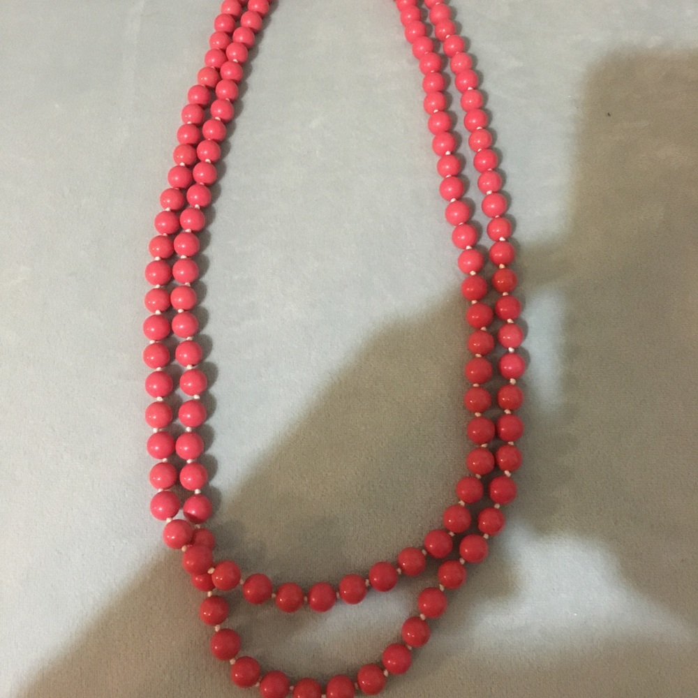 Coral extra long layering necklace.